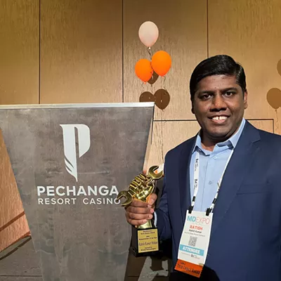 Image: Ratish Kumar accepts 2025 Humanitarian of the Year award