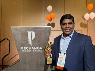 Image: Ratish Kumar accepts 2025 Humanitarian of the Year award